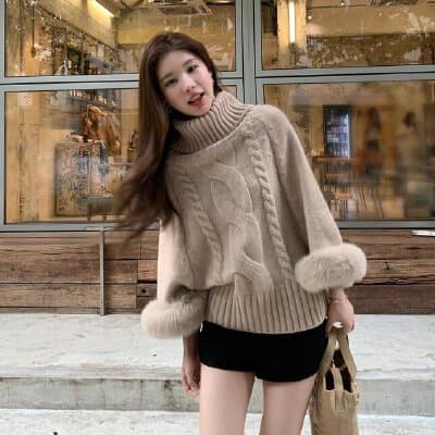 Retro-style cable knit off-shoulder cape sweater
